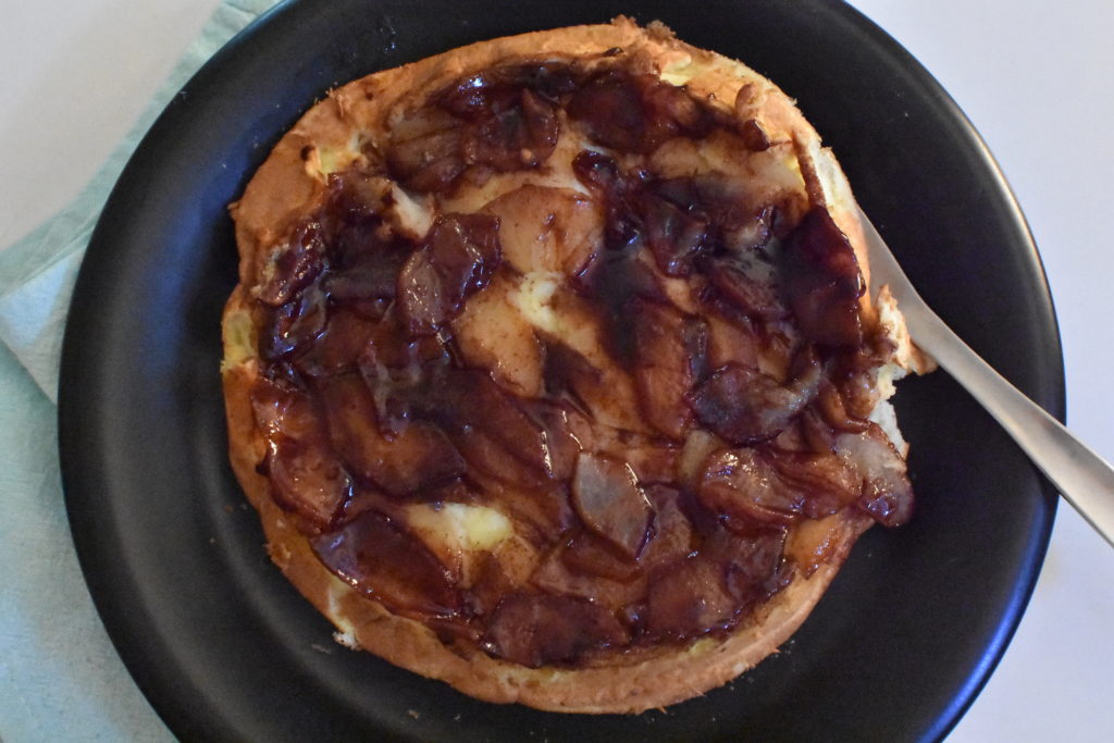 Apple pancake on black plate