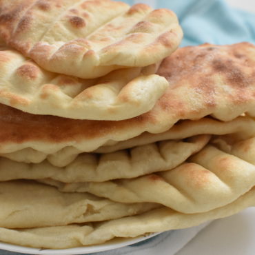 Stack of pita bread on a plate