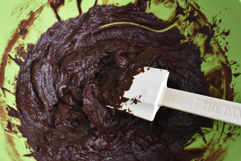 Chocolate pudding batter in green bowl